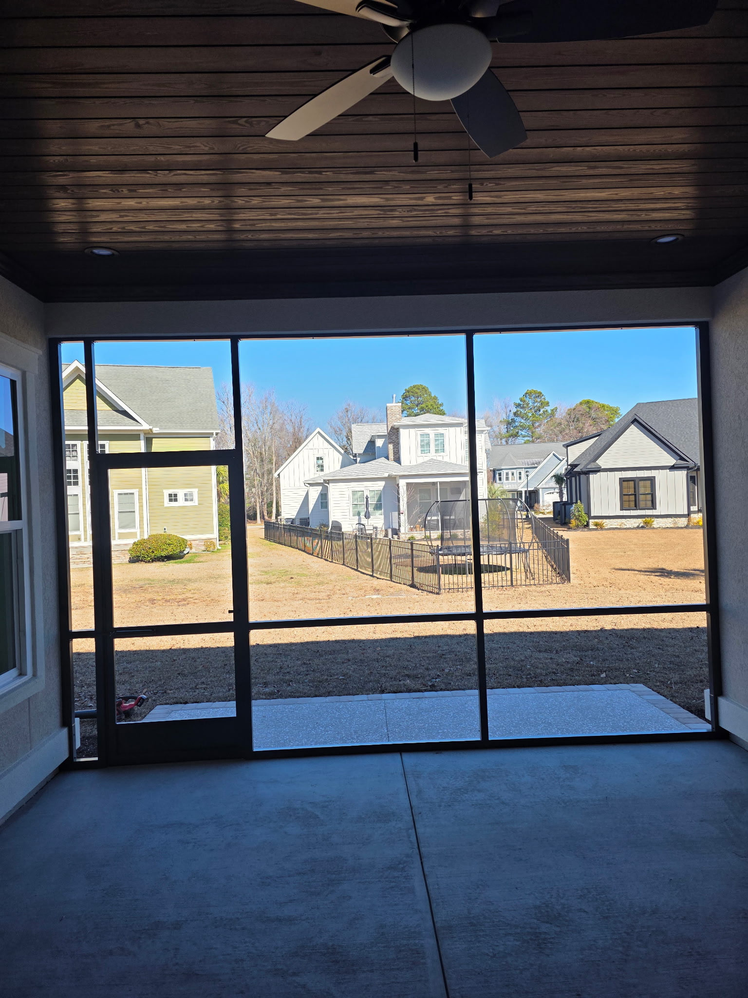 View through a black-framed screened porch